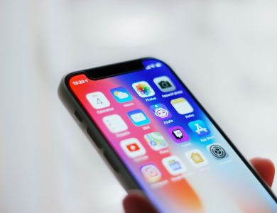 person holding black iphone 4