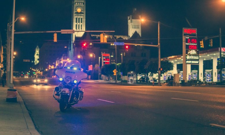 white police motorcycle park on road
