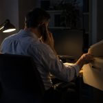 One owner-director of a twelve-person engineering consultancy sits alone after hours in the cramped accounts office,